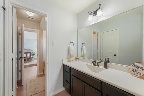 a bathroom with a sink double vanity and a mirror