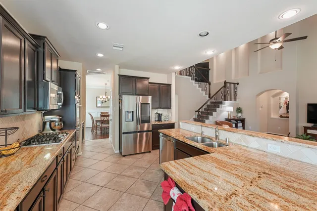 a living room with furniture or wooden floor and a fireplace