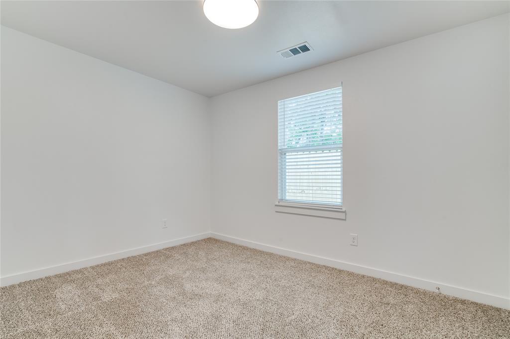 507 Campbell Street Terrell, TX 75160 - Photo 11 of 13 an empty room with a window