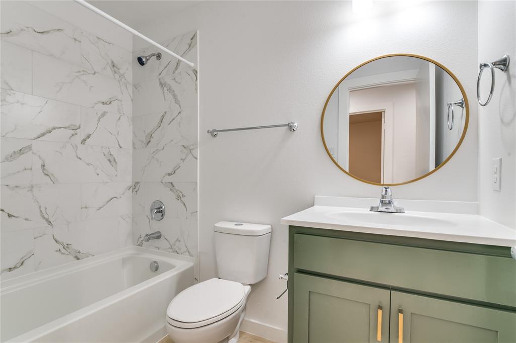 507 Campbell Street Terrell, TX 75160 - Photo 12 of 13 a bathroom with a sink toilet and shower