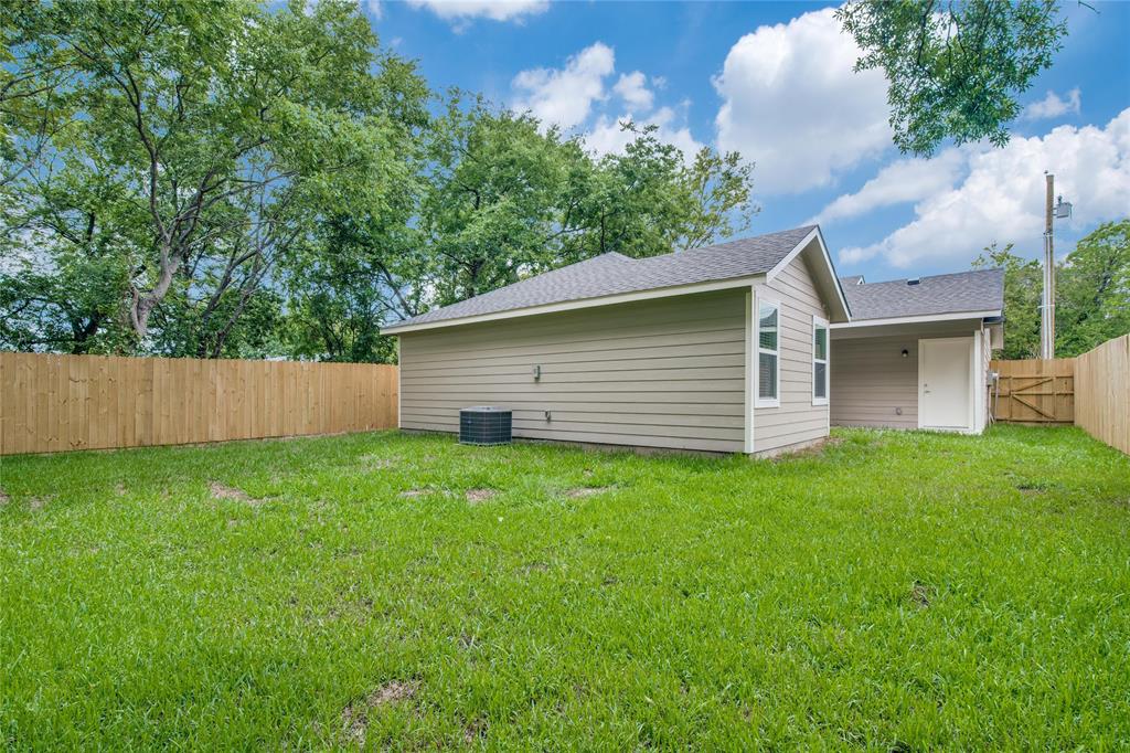 507 Campbell Street Terrell, TX 75160 - Photo 2 of 13 a view of a backyard with barn and large trees