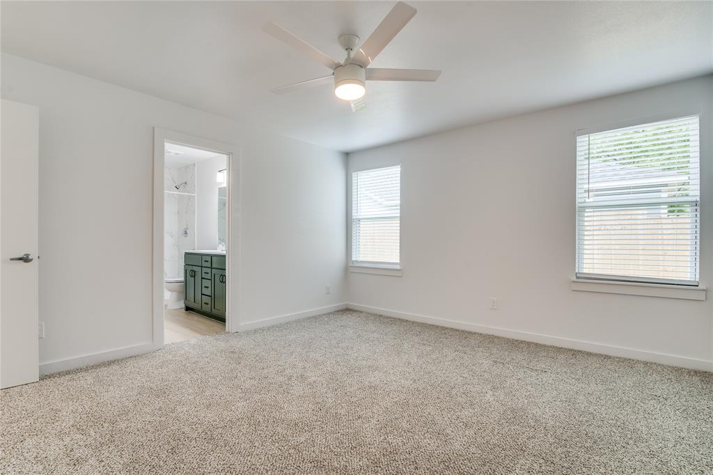 507 Campbell Street Terrell, TX 75160 - Photo 8 of 13 an empty room with windows and fan