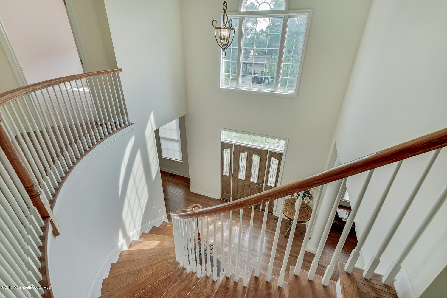 391 South Cooks Bridge Road Jackson, NJ 08527 - Photo 8 of 49 a view of staircase with lots of frames on wall and wooden floor