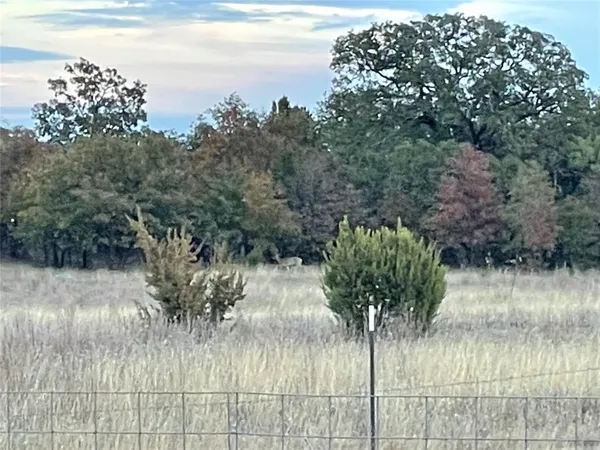a view of a lake with a big yard
