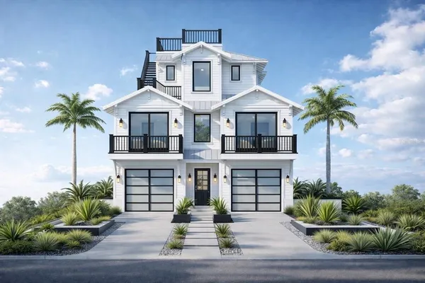 a front view of a house with plants