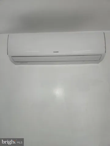 a view of empty room with wooden ceiling