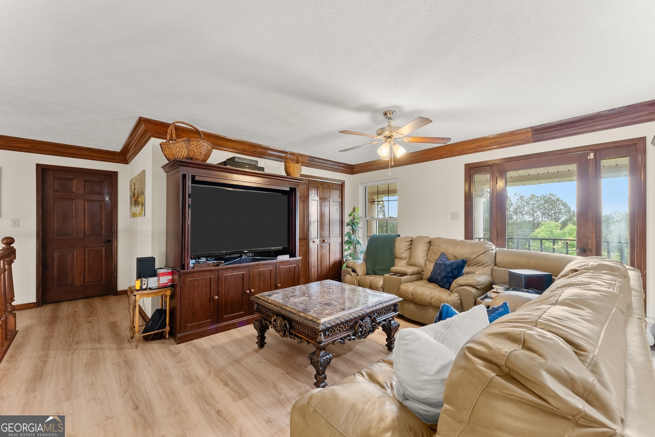7215 Kelly Bridge Road Dawsonville, GA 30534 - Photo 33 of 81 a living room with furniture and a flat screen tv