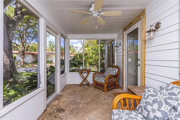 a view of a chairs and table in backyard