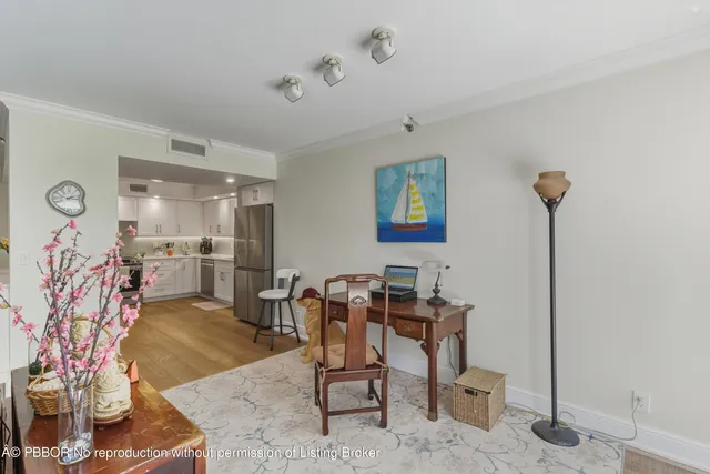 a room with lots of chairs and mirrors