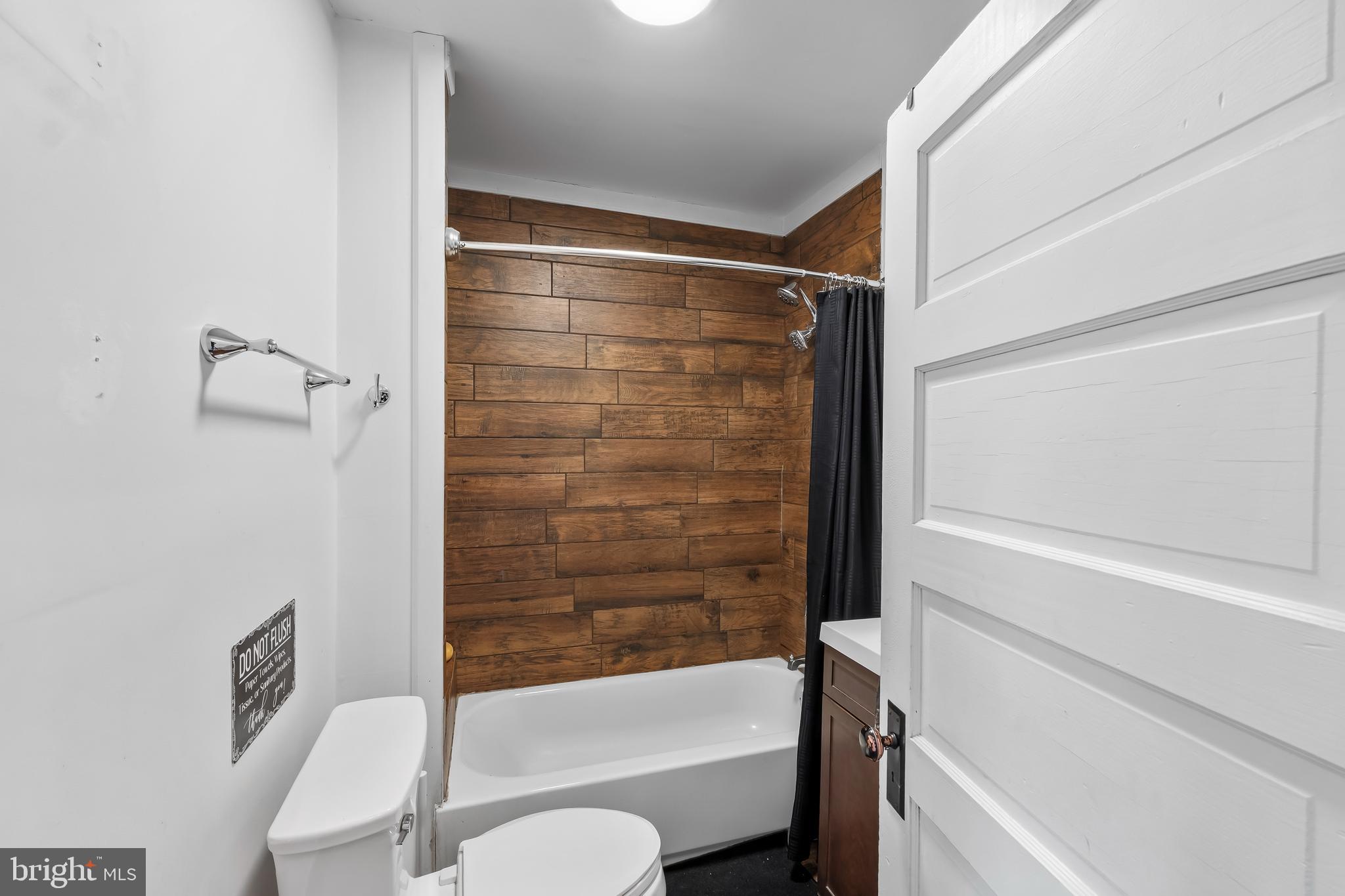 708 South 3rd Street Millville, NJ 08332 - Photo 12 of 33 a bathroom with a shower and a toilet