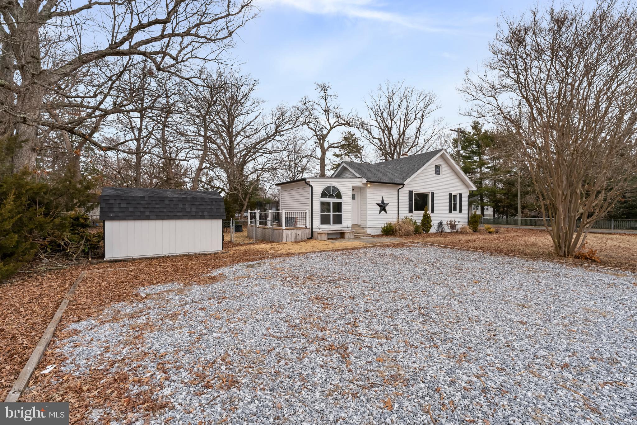 708 South 3rd Street Millville, NJ 08332 - Photo 29 of 33 a view of white house with a yard and large tree