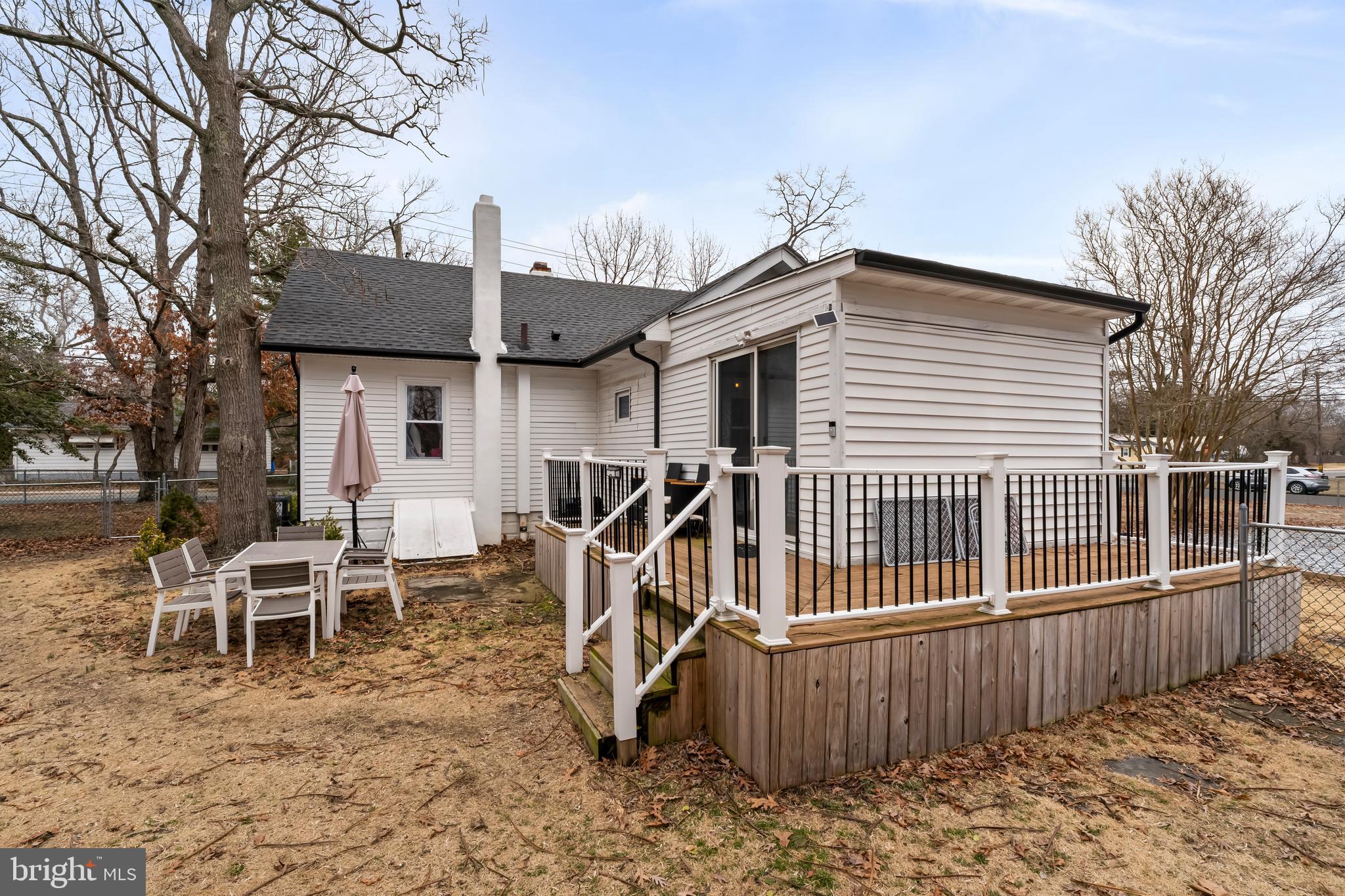 708 South 3rd Street Millville, NJ 08332 - Photo 30 of 33 a view of a house with backyard and a wooden deck
