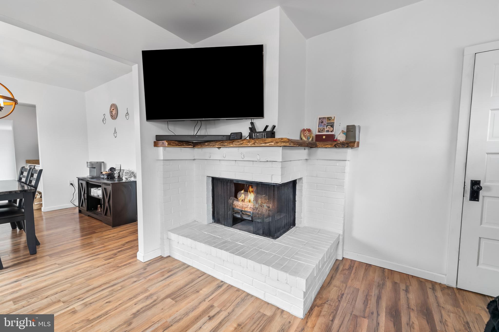 708 South 3rd Street Millville, NJ 08332 - Photo 3 of 33 a living room with furniture and a fireplace