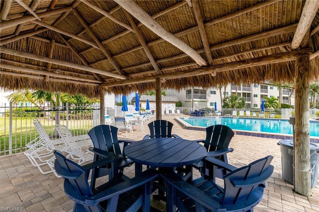 1018 Manatee Road, Unit E302 Naples, FL 34114 - Photo 17 of 19 View of patio / terrace with a gazebo and a community pool