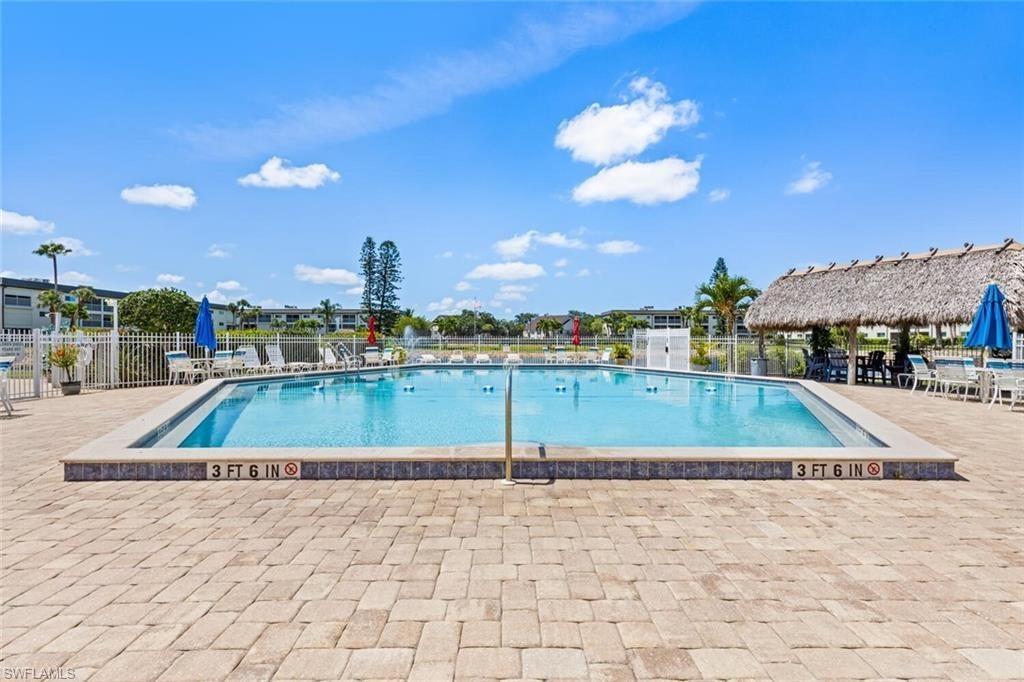1018 Manatee Road, Unit E302 Naples, FL 34114 - Photo 19 of 19 Community pool featuring a patio