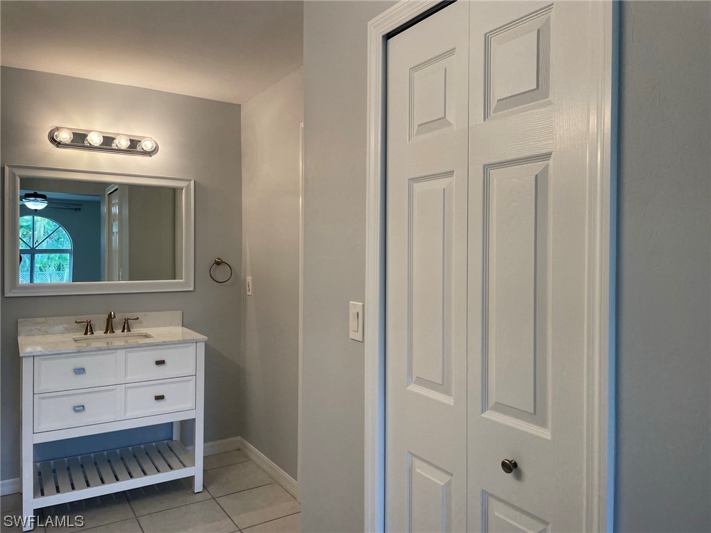 5727 Rose Garden Road, Unit B Cape Coral, FL 33914 - Photo 17 of 26 a bathroom with a sink vanity and a mirror