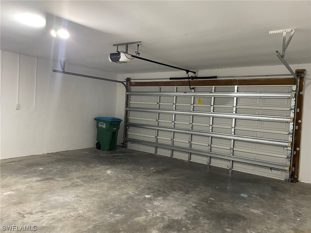5727 Rose Garden Road, Unit B Cape Coral, FL 33914 - Photo 25 of 26 a view of a garage