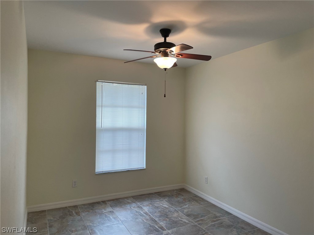 5727 Rose Garden Road, Unit B Cape Coral, FL 33914 - Photo 5 of 26 a view of a chandelier fan in a room