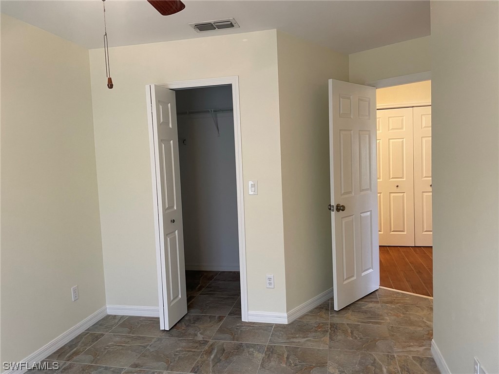 5727 Rose Garden Road, Unit B Cape Coral, FL 33914 - Photo 6 of 26 a view of an empty room with closet area