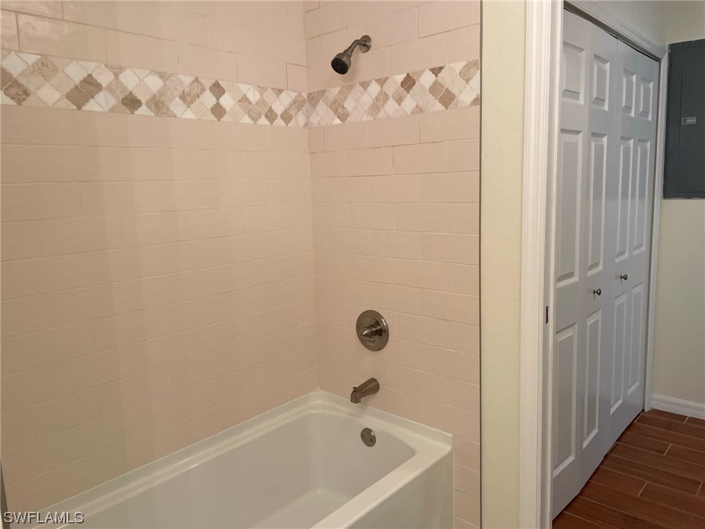5727 Rose Garden Road, Unit B Cape Coral, FL 33914 - Photo 10 of 26 a bathroom with a bathtub