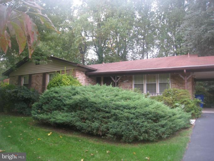 12912 Ruxton Road Silver Spring, MD 20904 - Photo 1 of 10 a front view of a house with a yard