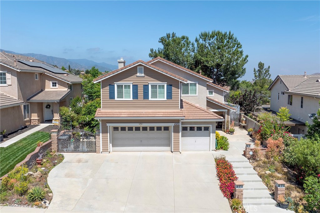 27441 Pacos Ridge Corona, CA 92883 - Photo 1 of 1 a front view of a house with a yard and garage
