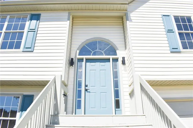 a view of a balcony and front door