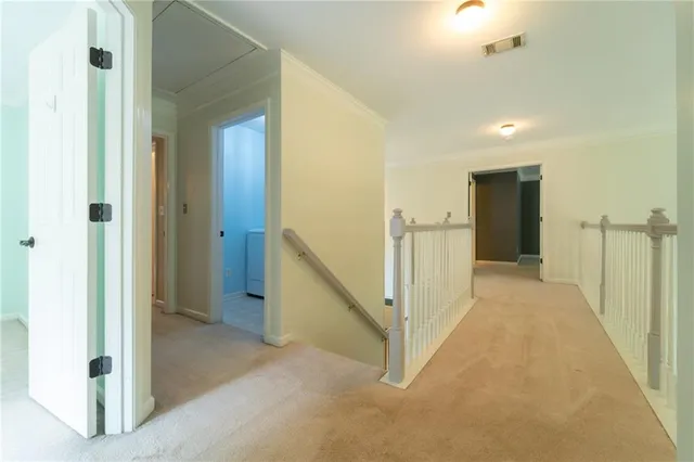 a view of a hallway with closet and entryway