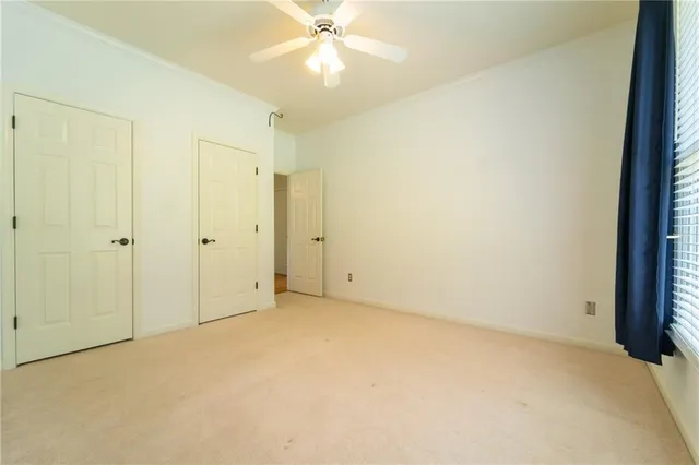 a view of a hallway with closet and entryway