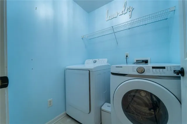 a utility room with dryer and washer
