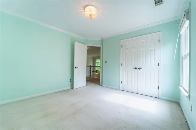 an empty room with closet area