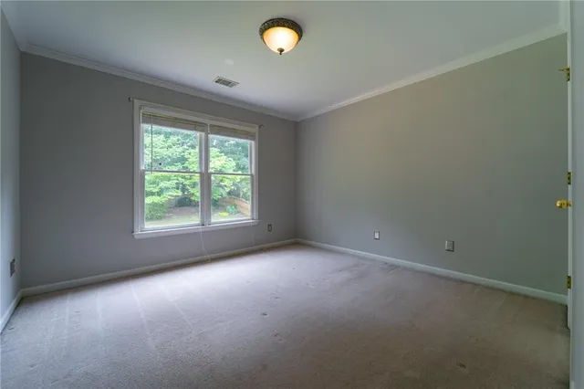 a spacious bathroom with a double vanity sink and a mirror