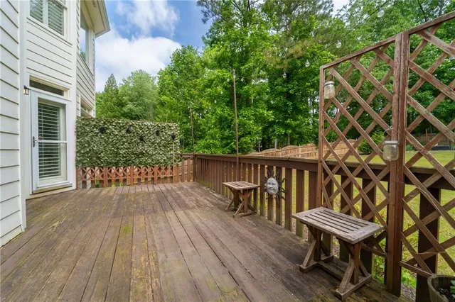 a view of house with swimming pool and outdoor seating