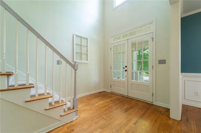 a view of a room with wooden floor and staircase
