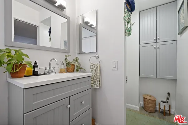 a bathroom with a sink and a mirror