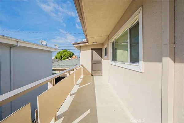 a view of a balcony with furniture