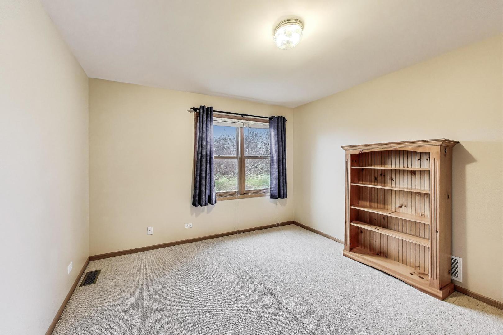1606 Beech Street Spring Grove, IL 60081 - Photo 27 of 59 a view of an empty room with a window