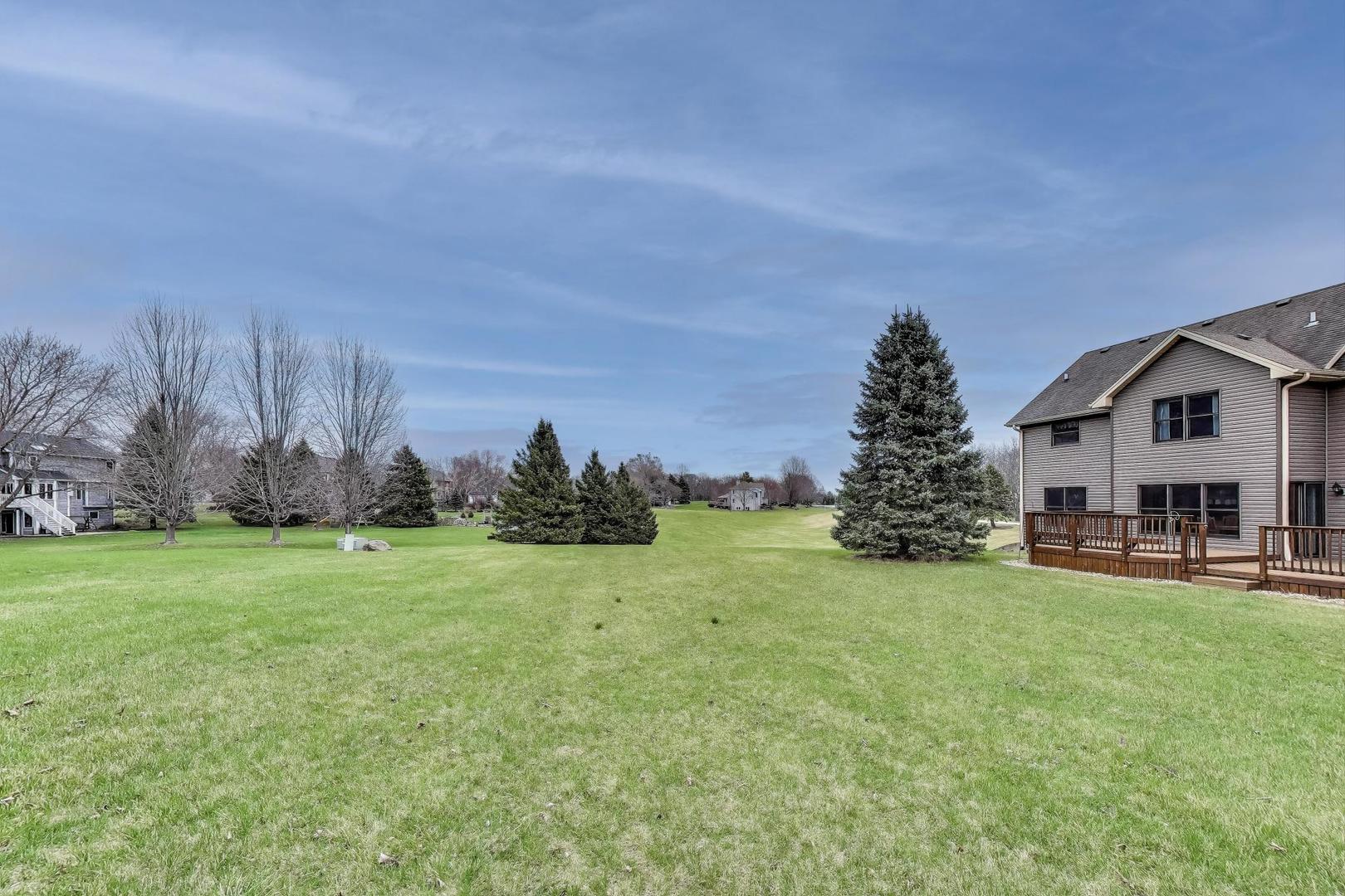 1606 Beech Street Spring Grove, IL 60081 - Photo 46 of 59 a front view of a house with garden