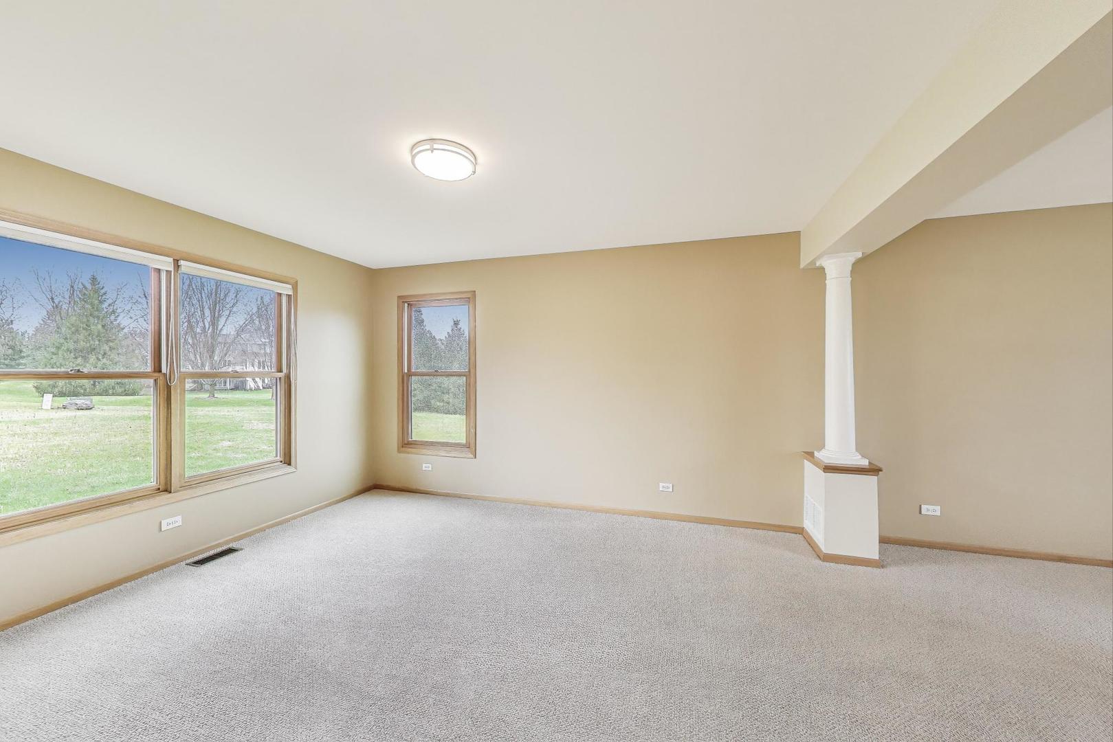 1606 Beech Street Spring Grove, IL 60081 - Photo 8 of 59 a view of an empty room with a window