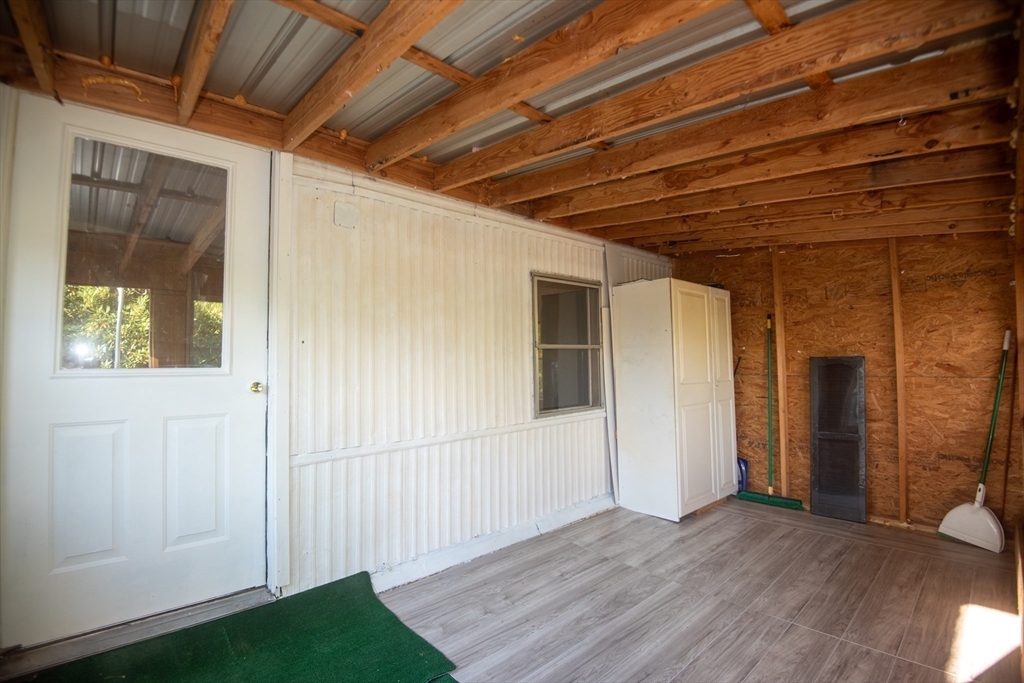 20 Dana Road Barre, MA 01005 - Photo 10 of 38 a view of an empty room with wooden floor and a window