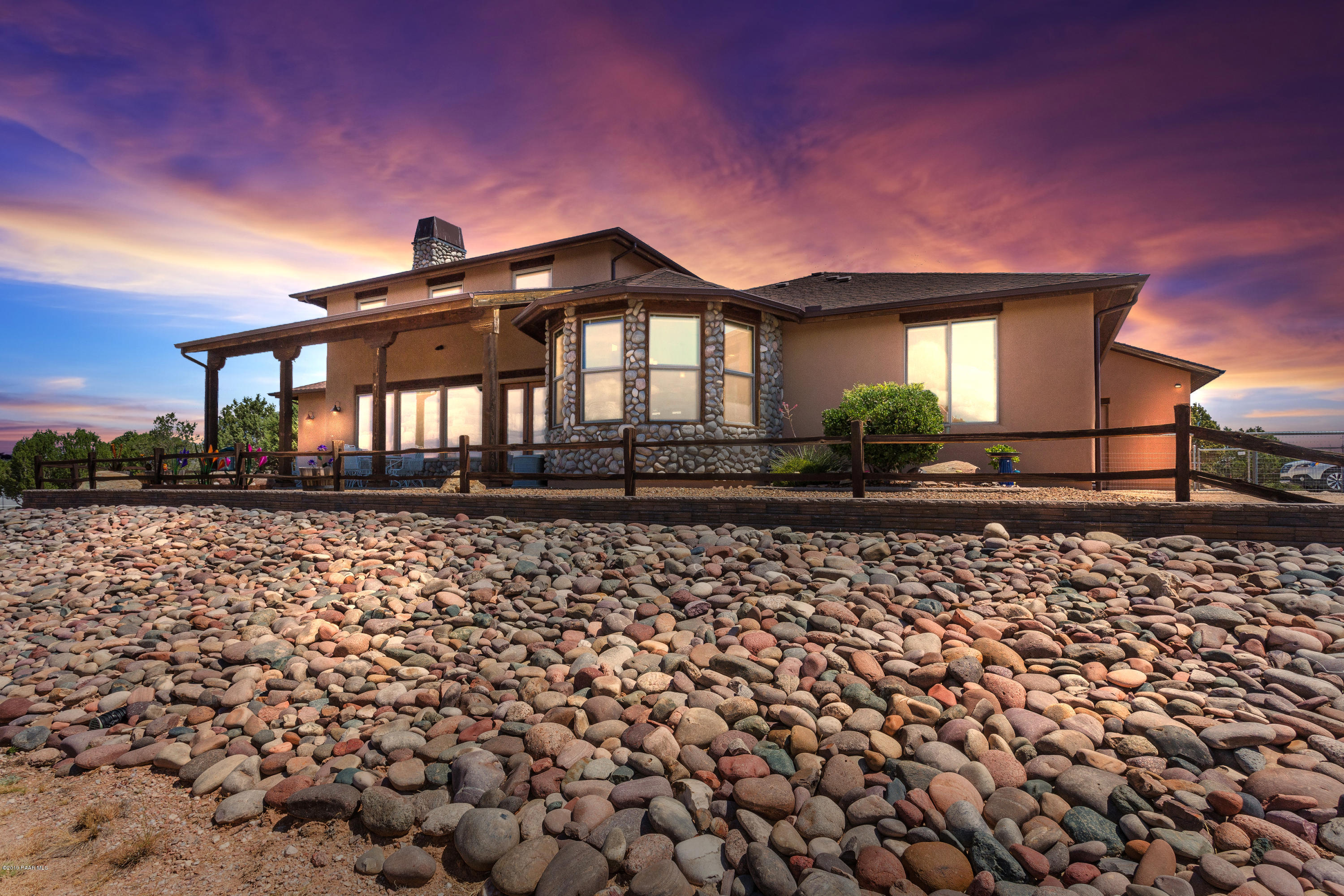 7301 Dillon Wash Road Prescott, AZ 86305 - Photo 1 of 36 a front view of a house with a yard