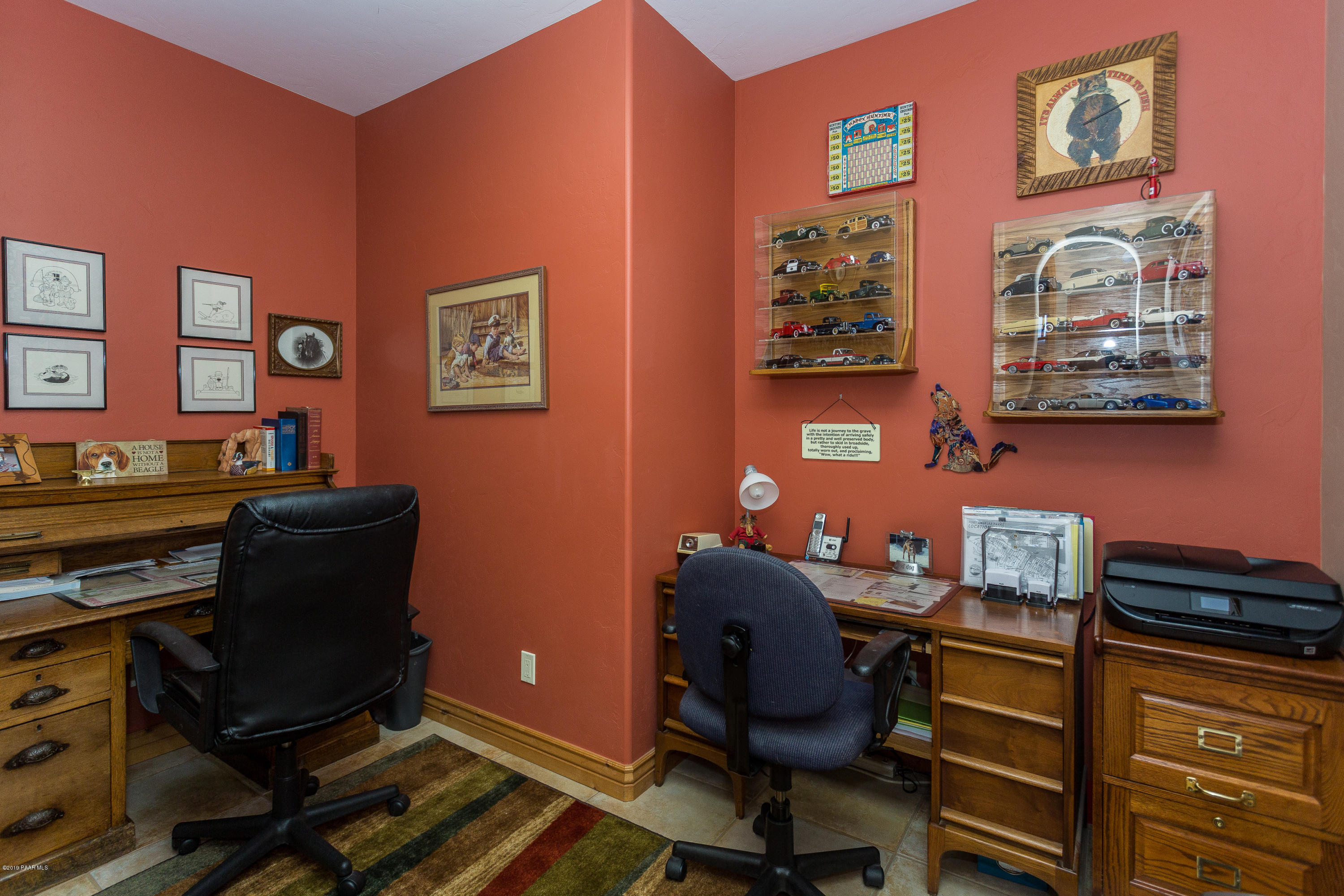 7301 Dillon Wash Road Prescott, AZ 86305 - Photo 13 of 36 a work room with furniture and paintings on the wall