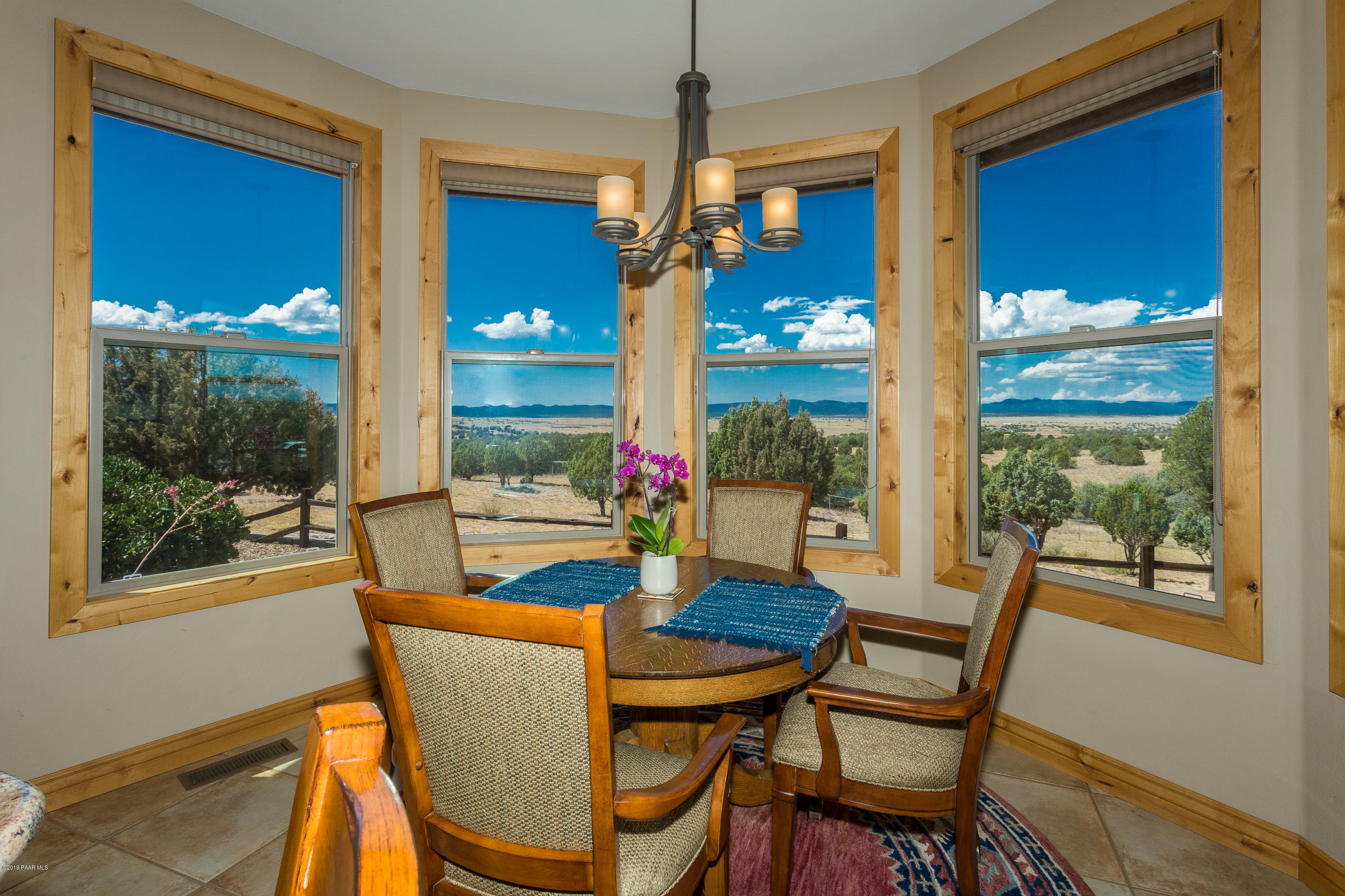 7301 Dillon Wash Road Prescott, AZ 86305 - Photo 14 of 36 a view of a dining room with furniture wooden floor and balcony