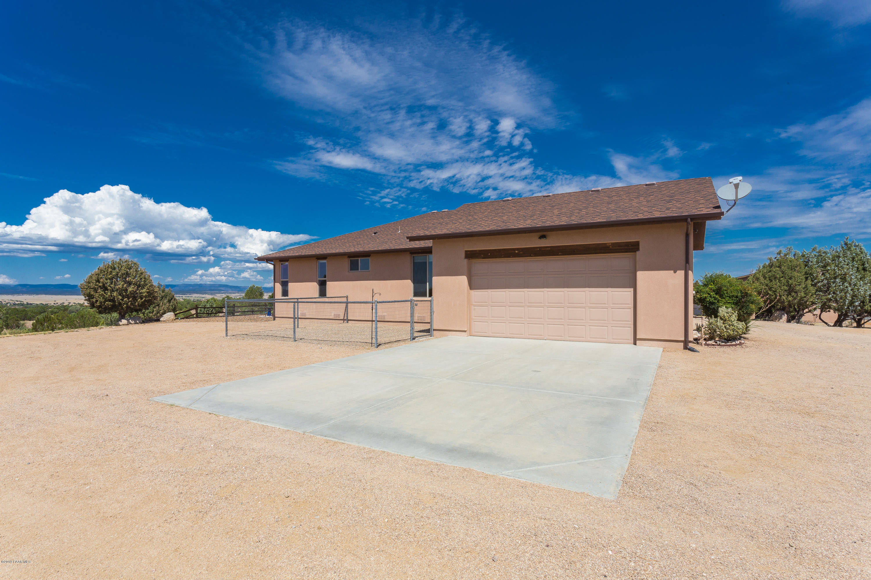 7301 Dillon Wash Road Prescott, AZ 86305 - Photo 24 of 36 a front view of a house with a yard and garage