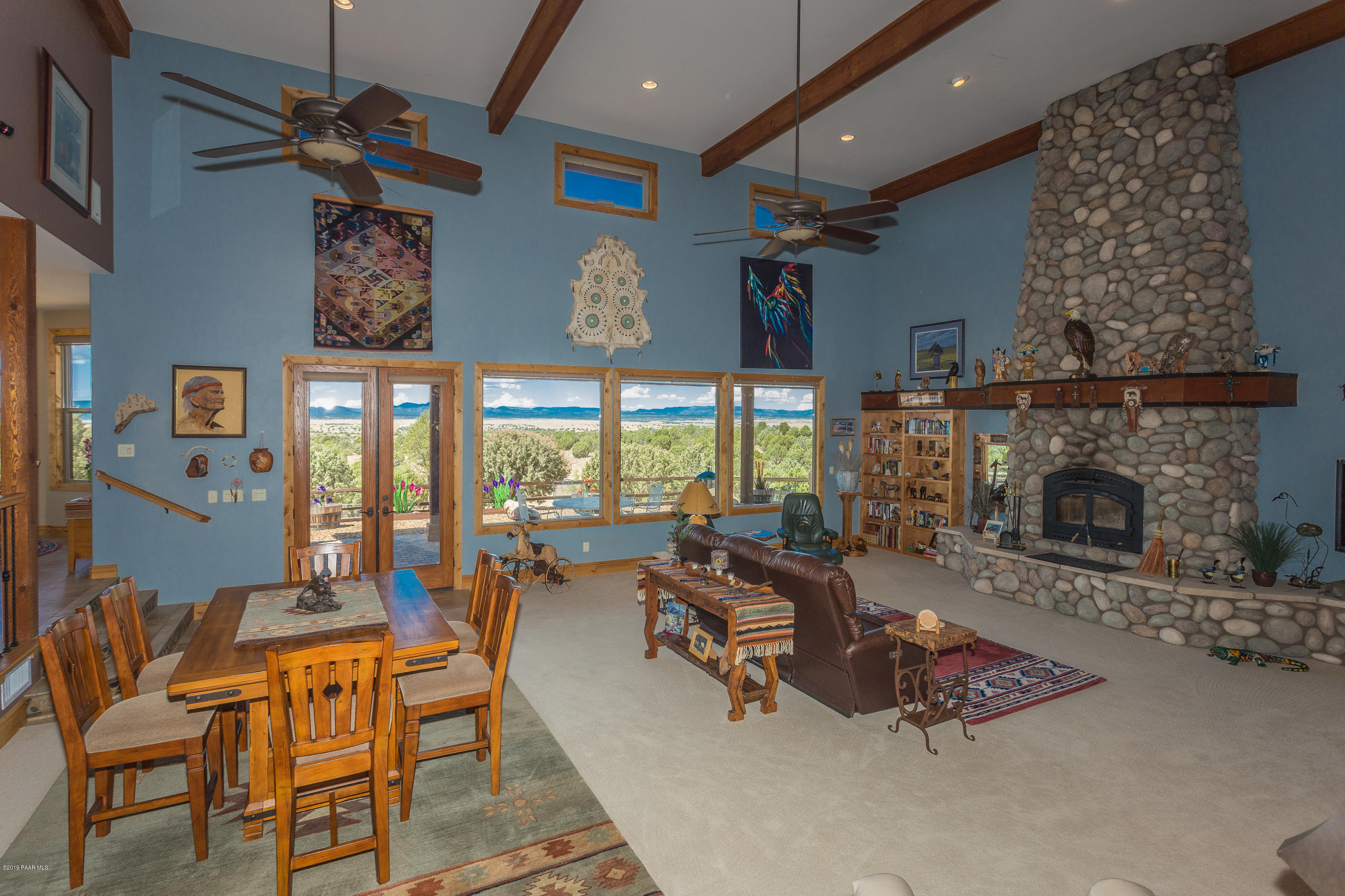7301 Dillon Wash Road Prescott, AZ 86305 - Photo 5 of 36 a living room with furniture and a fireplace