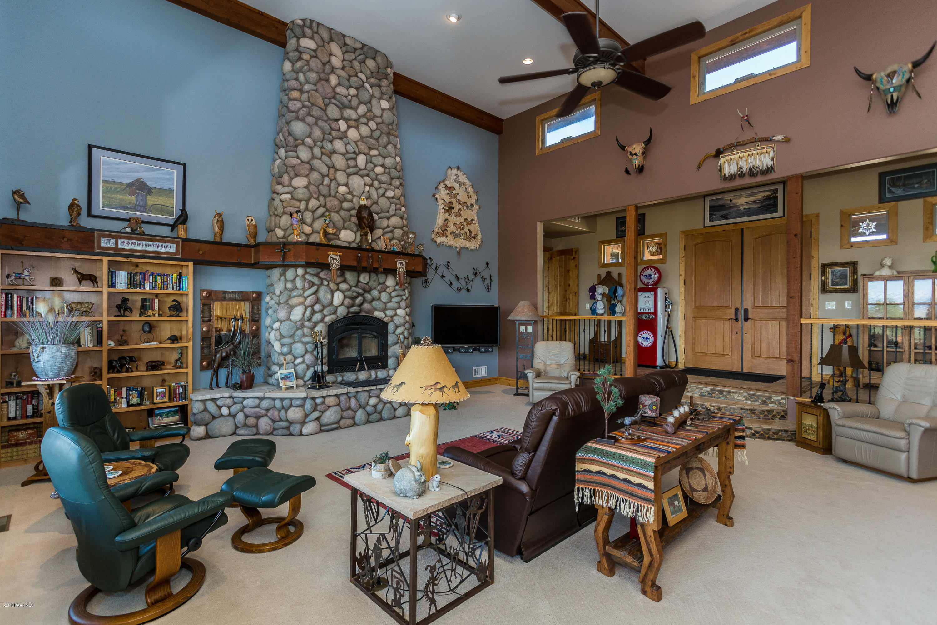 7301 Dillon Wash Road Prescott, AZ 86305 - Photo 6 of 36 a living room with furniture and a fireplace