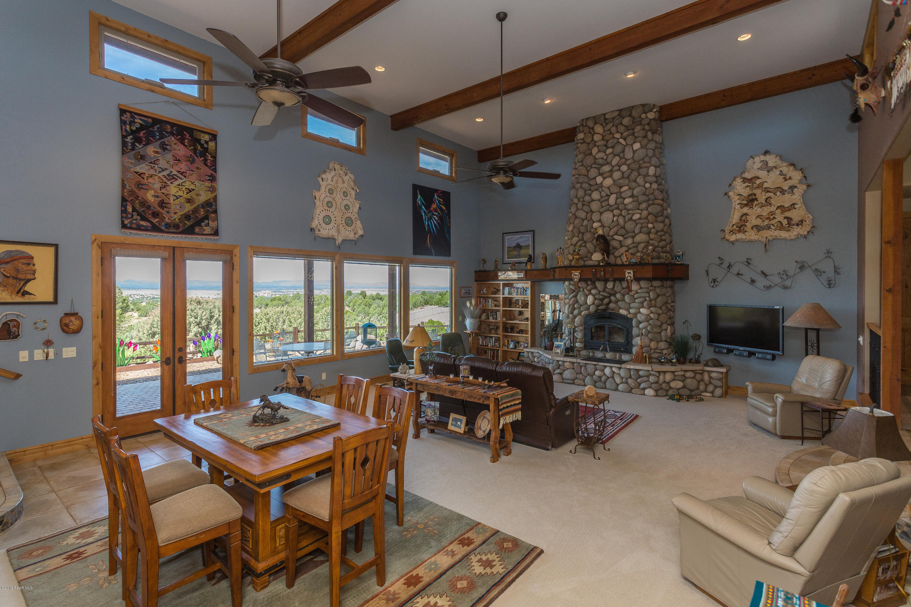 7301 Dillon Wash Road Prescott, AZ 86305 - Photo 7 of 36 a living room with fireplace furniture and a large window
