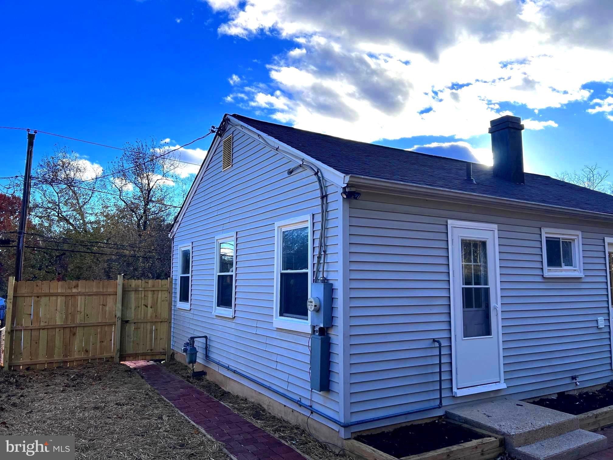 708 Crabb Avenue Rockville, MD 20850 - Photo 13 of 24 a view of a house with a yard