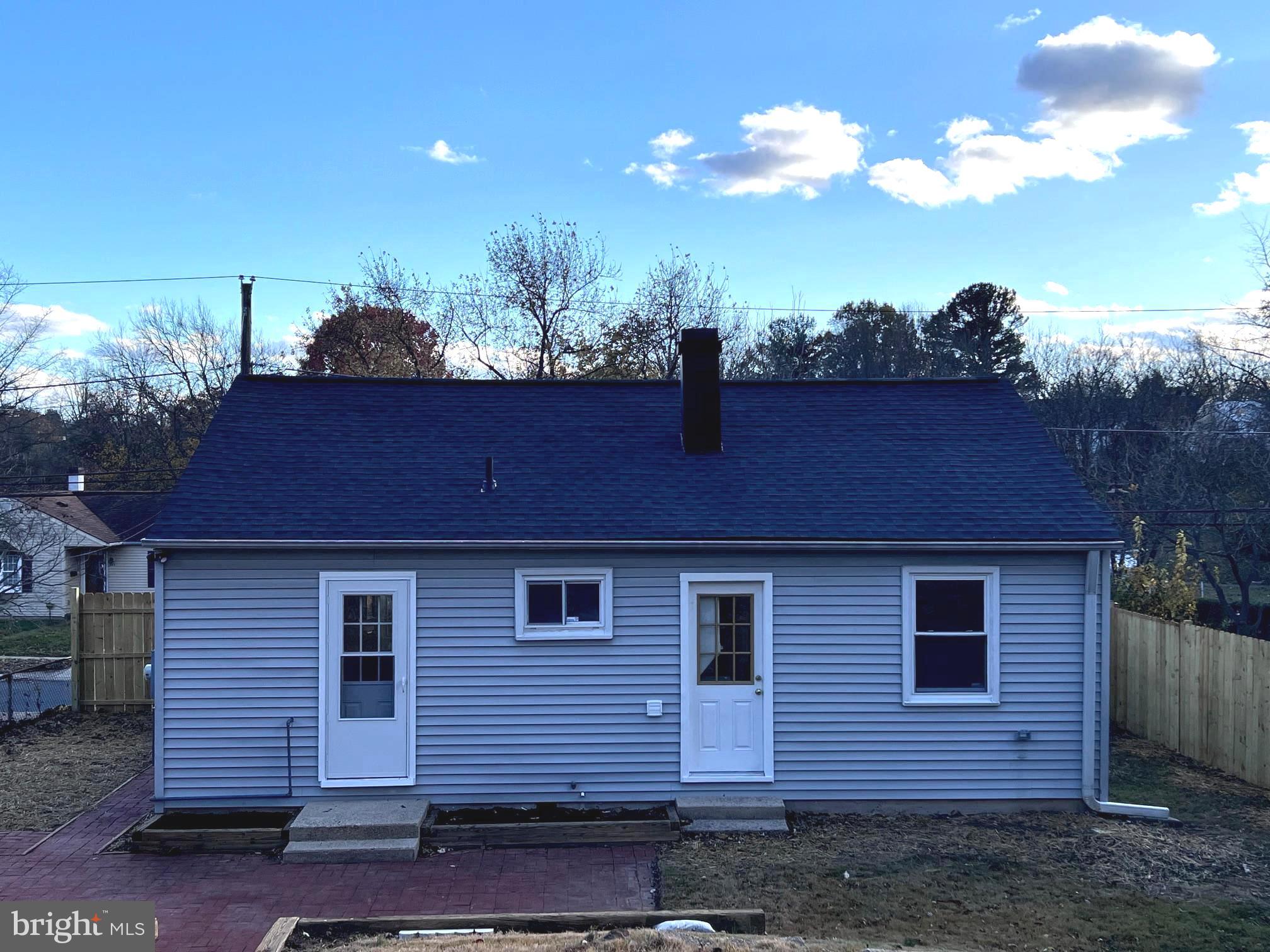708 Crabb Avenue Rockville, MD 20850 - Photo 14 of 24 a front view of a house with a yard
