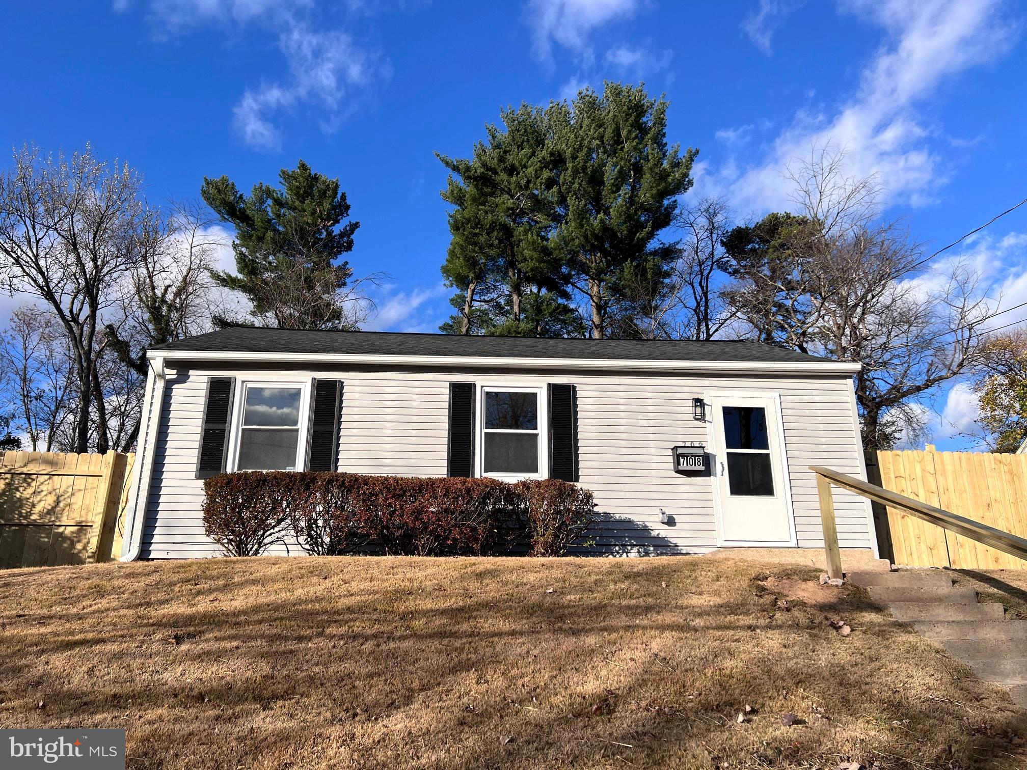 708 Crabb Avenue Rockville, MD 20850 - Photo 24 of 24 a front view of a house with a yard and garage